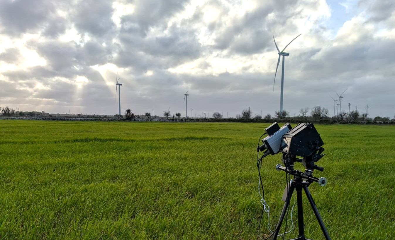 ALIDA laser system deployed in the field observing a wind turbine at distance